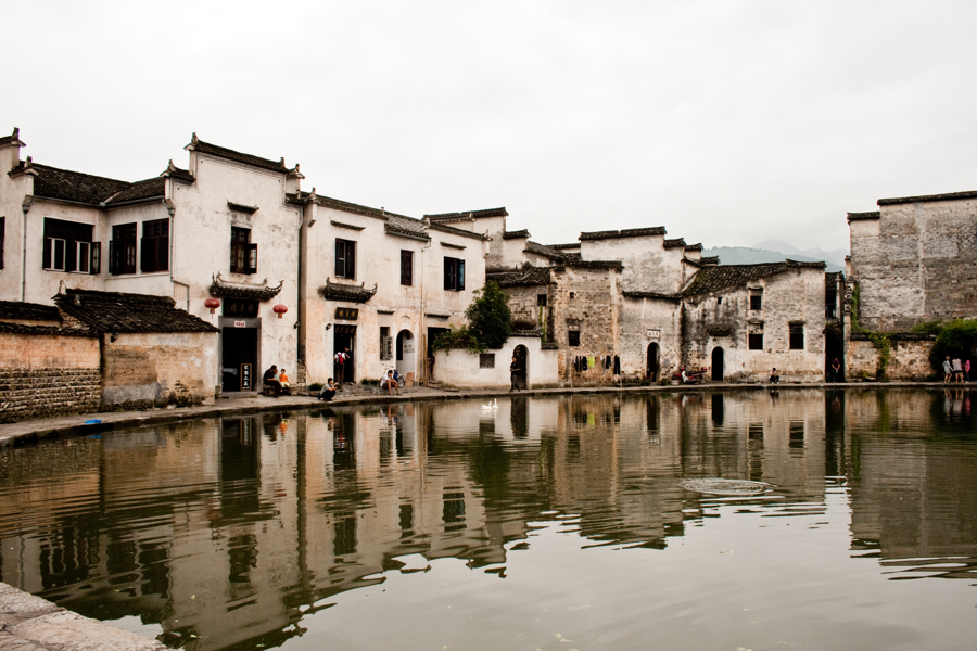 Traditional houses and reflections beside Moon Pond, Hongcun