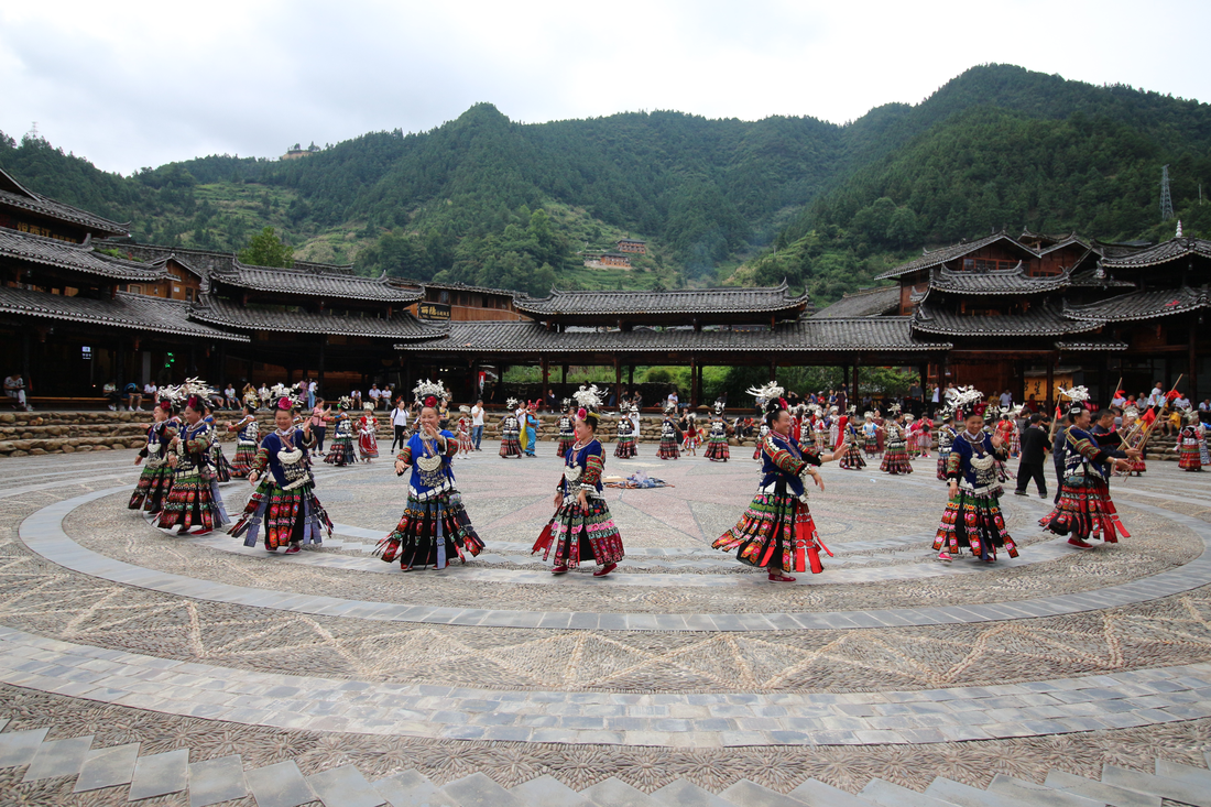 A staged Miao dance performance at Xijiang Miao Village · Qiandongnan