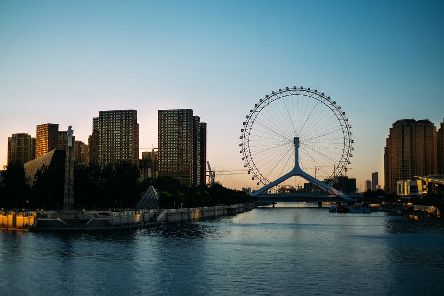 Tianjin Eye above the Haihe River at dusk